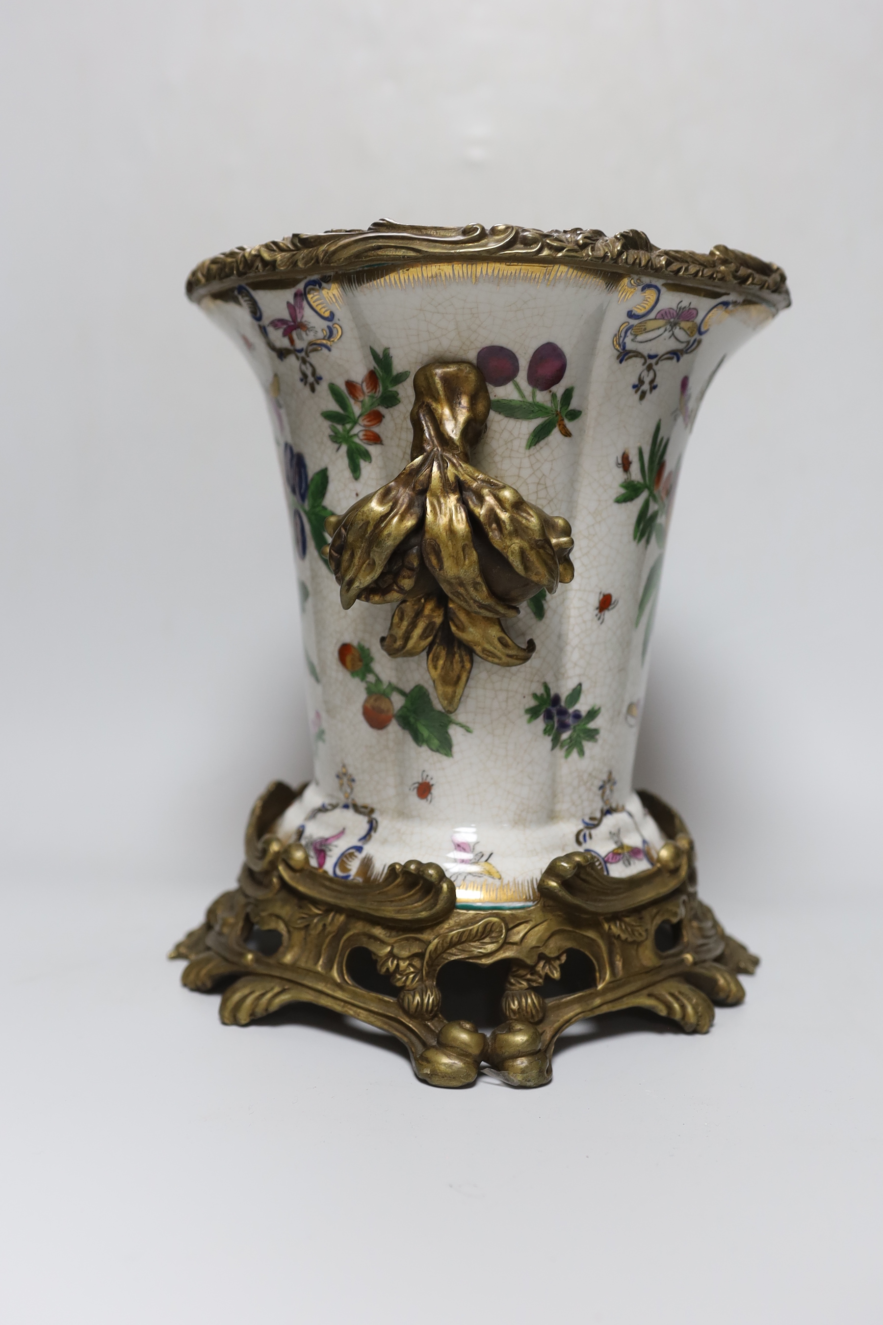 A brass mounted porcelain vase, 27cm